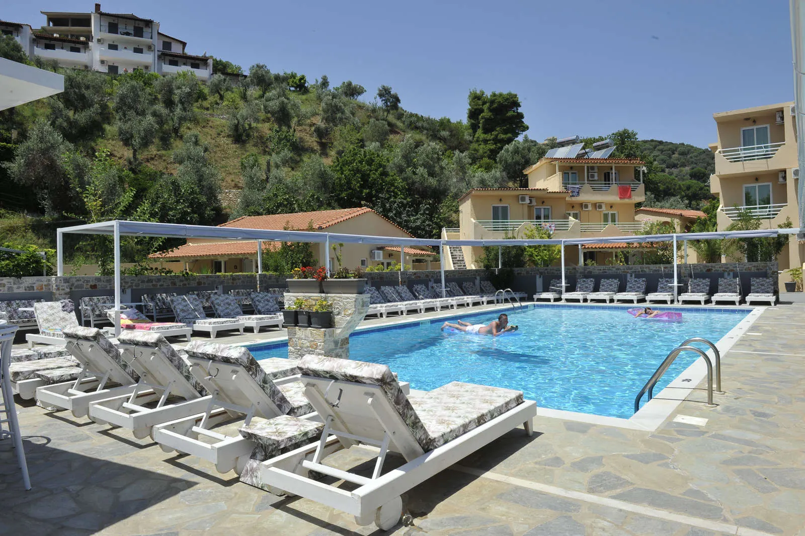 Sunbeds around the pool on a sunny day