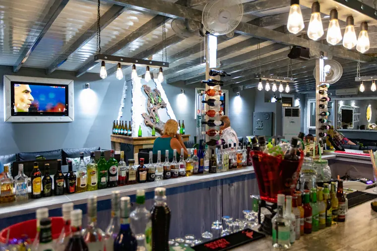 Bottles, screens and the cocktail station