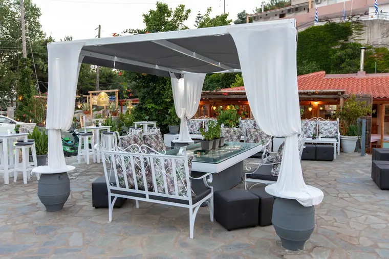 The white cabana with curtains at dusk