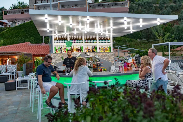 Guests at the round bar by the pool