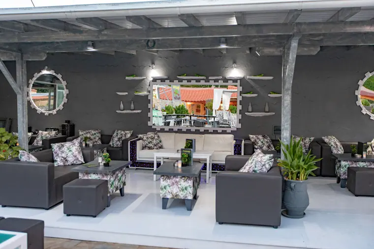 Lounge sofas under the round mirrors