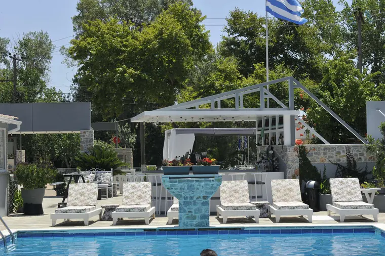 The pool, the mosaic waterfall and the cabana